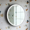 Noir LED Illuminated Round Black Framed Mirror With Demister Pad & Colour Change LEDs - 600mm -Vado Sale Store rosie led round black frame mirror lifestyle