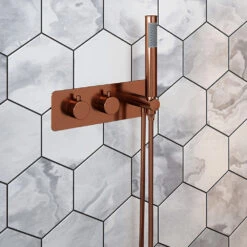 The Tap Factory Vibrance Copper WRAS Approved Concealed Thermostatic Shower Valve With Fixed Shower Head And Shower Handset 8 The Tap Factory Vibrance Copper WRAS Approved Concealed Thermostatic Shower Valve With Fixed Shower Head And Shower Handset -Vado Sale Store the tap factory vibrance shower valve and handset copper lifestyle